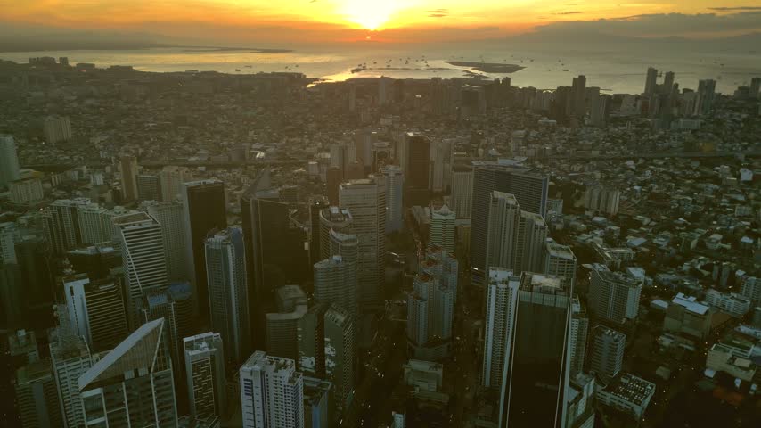 Aerial view of the modern skyscrapers and dense urban landscape of the financial district in Manila, Metro Manila, Philippines.