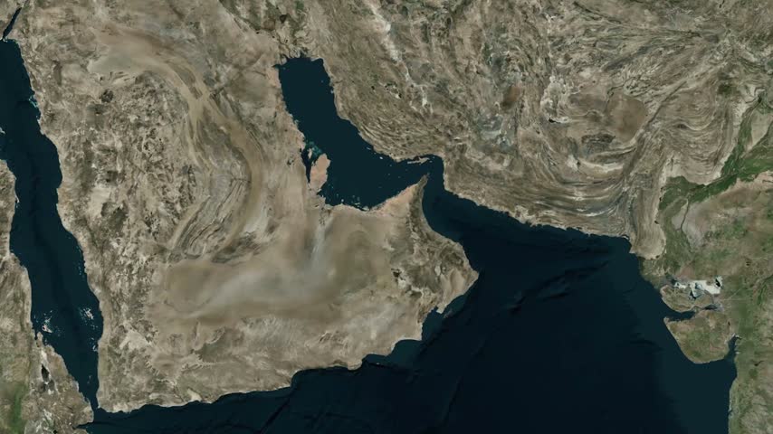 Detailed satellite map animation zooming in from a wide view of the Arabian Peninsula and Persian Gulf to highlight the Emirate of Abu Dhabi in the United Arab Emirates, featuring a distinct location marker and label.