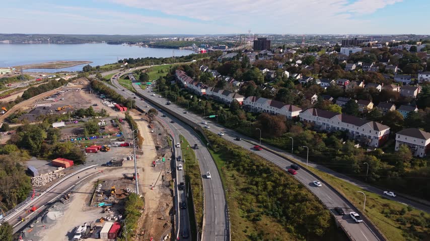 Stunning aerial perspectives showcase the vibrant city of Halifax, Nova Scotia. The clip reveals the scenic waterfront, bustling streets, and rich greenery, highlighting urban life and natural beauty.
