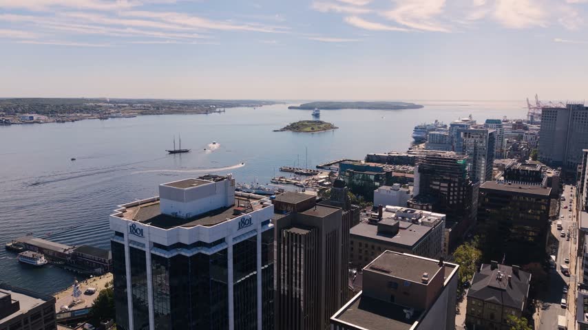 Witness breathtaking aerial perspectives of Halifax, Nova Scotia, showcasing the vibrant harbor, boats, and the city
