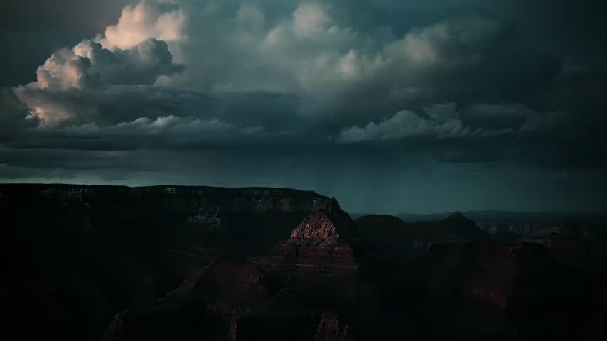 Stormy Sky Over Dark Canyon Landscape at Dusk