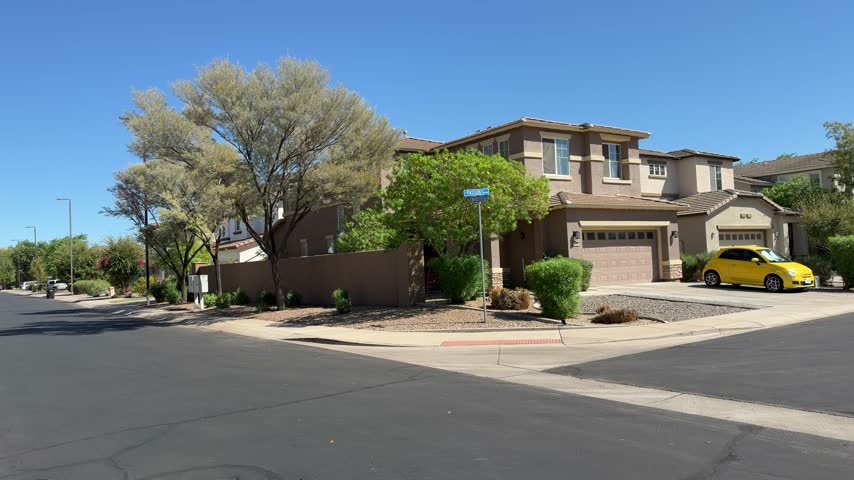 Suburban neighborhood street corner with stucco houses