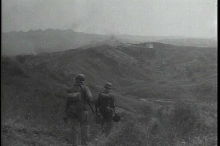 1940s - The 6th infantry division battles Japanese soldiers in the Philippines during World War 2