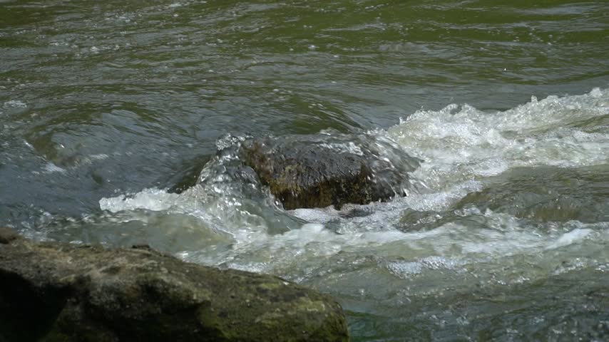water flowing into the river