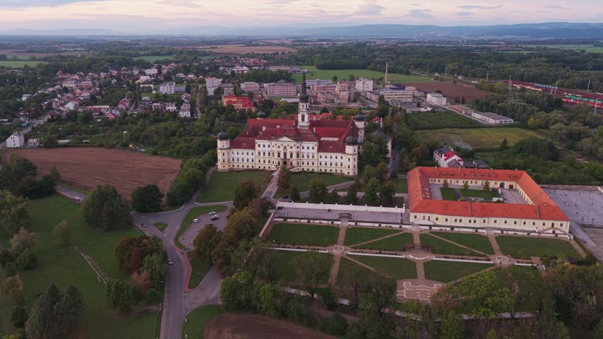 Aerial view of the historic Hradisko Monastery with its red roofs, surrounding gardens, and sprawling grounds in Olomouc, Olomouc Region, Czechia.