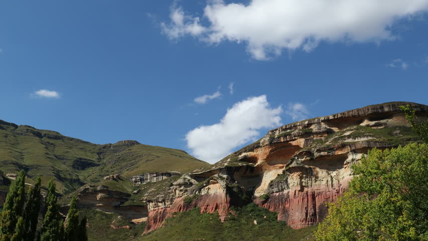 Time lapse of clouds over the scenic sandstone rocks in late afternoon light, Golden Gate National Park, South Africa