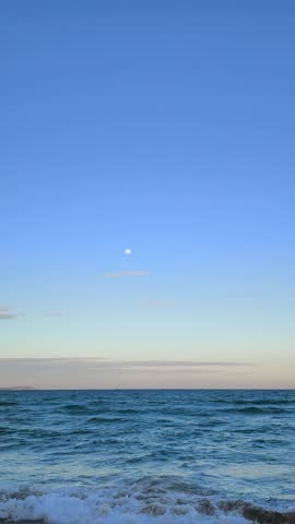 tranquil beach landscape with a wide blue sky and sea