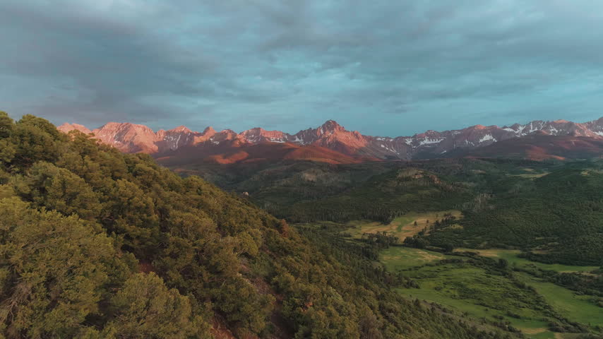 Alpenglow on the San Juan Mountains at sunset aerial