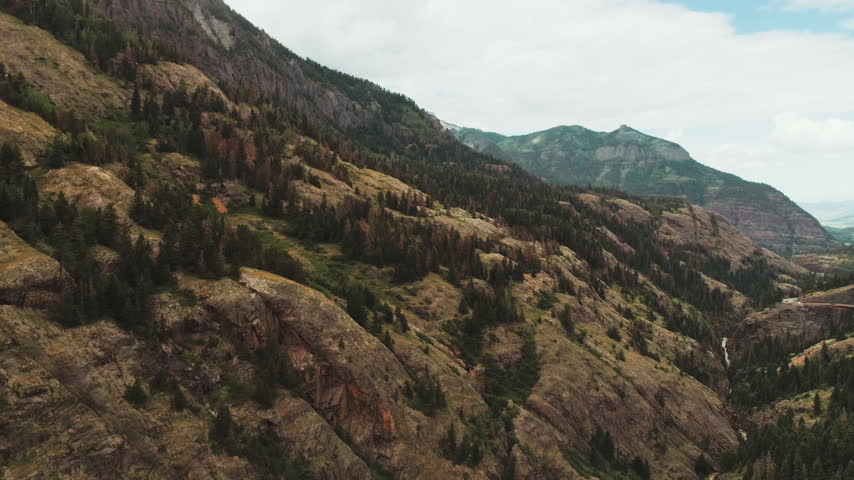 Rocky canyon wall with pine forest near Ouray Colorado aerial