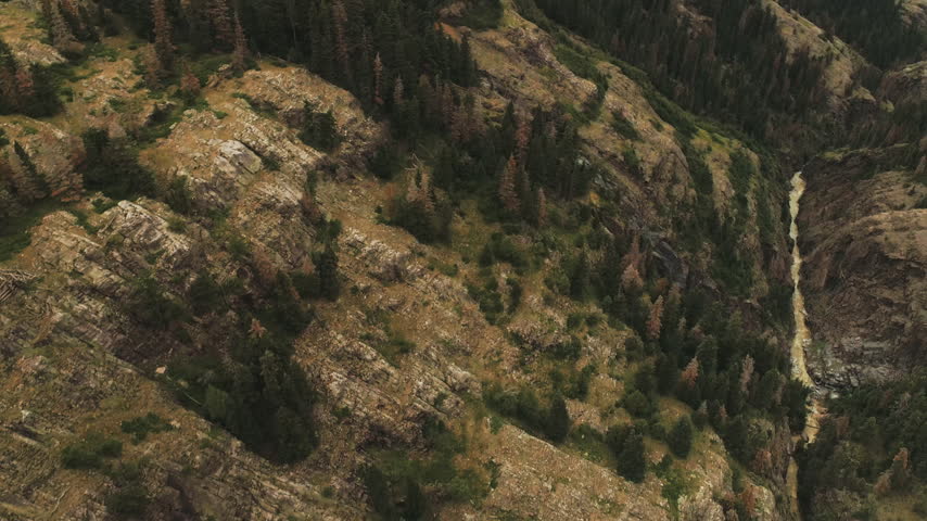 Steep canyon wall and creek near Ouray Colorado aerial