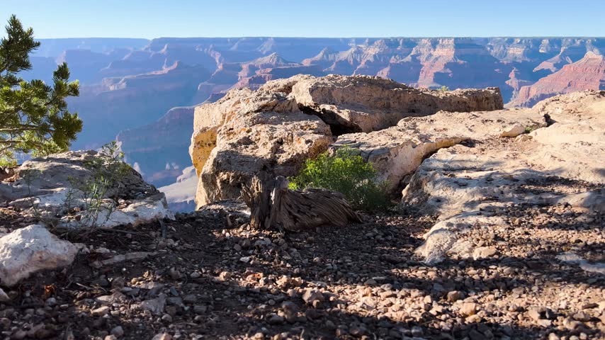 Grand Canyon rim overlook with rocky foreground in Arizona, United States