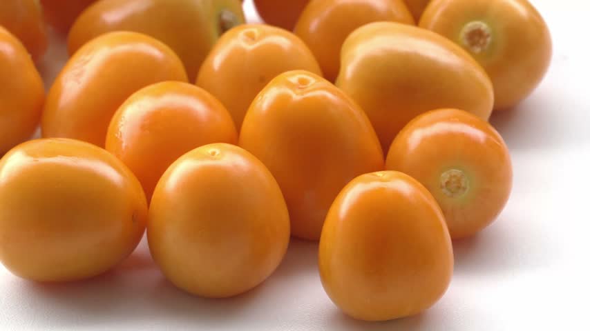Peeled aguaymanto fruits without husks on white background in 4K for healthy food, retail, packaging and superfood advertising
