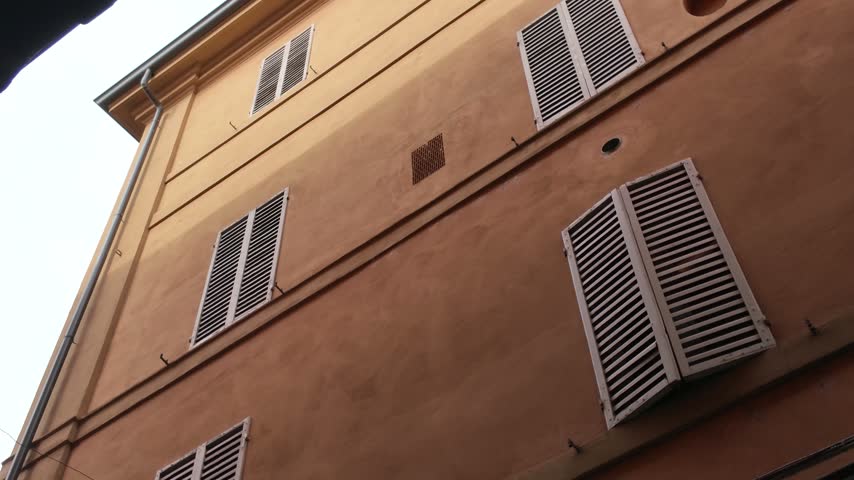 Street view around the city and old town of Bologna in Italy on a sunny summer day