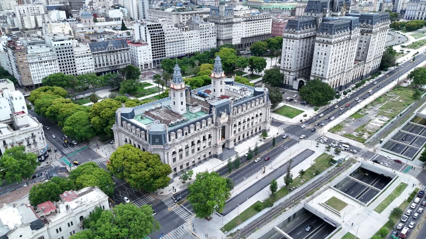 Aerial view of the historic Edificio Libertador surrounded by urban streets, green trees, and city buildings in Buenos Aires, Buenos Aires, Argentina.