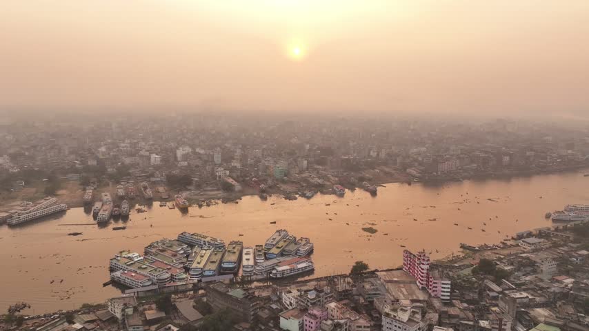 Aerial view of Dhaka Sadarghat river port on the Buriganga River in Bangladesh during a beautiful sunset