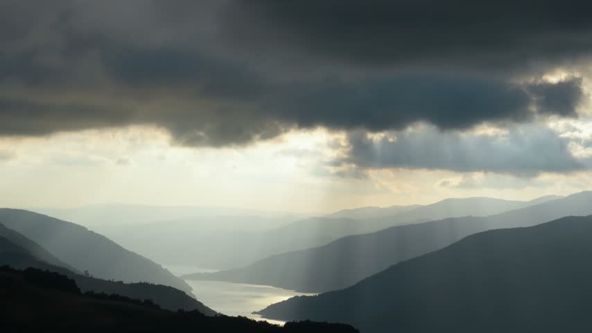 Sunset over the foggy mountains