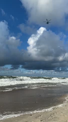 a dark blue cloud over the Baltic Sea
