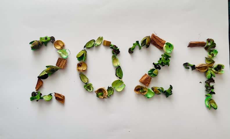Creative eco-friendly stock photo series representing the year 2027 crafted from natural green and golden dried potpourri elements, ideal for sustainable living blogs, green holiday campaigns, zero-waste New Year greeting cards, and eco-brand promos.