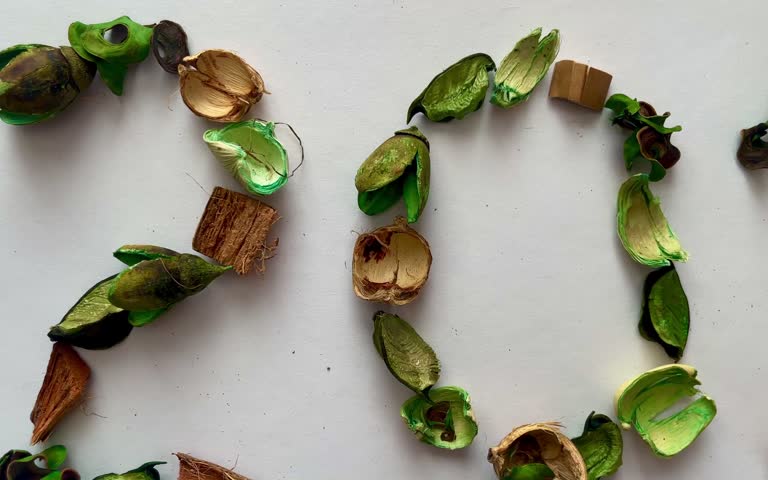 Creative eco-friendly stock photo series representing the year 2027 crafted from natural green and golden dried potpourri elements, ideal for sustainable living blogs, green holiday campaigns, zero-waste New Year greeting cards, and eco-brand promos.