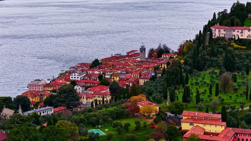 Aerial view of the historic town of Bellagio with its red-tiled rooftops and lush gardens overlooking the lake in Bellagio, Lombardia, Italy.