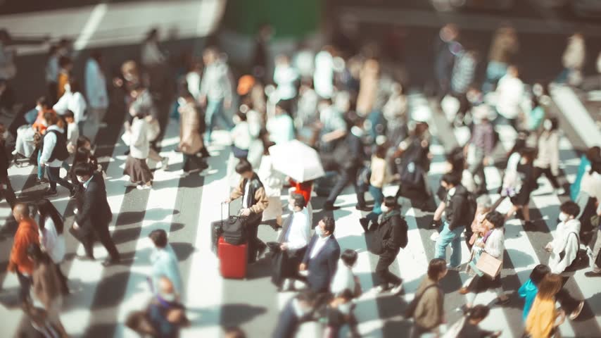 People Crossing a Busy Urban Crosswalk in Osaka Japan