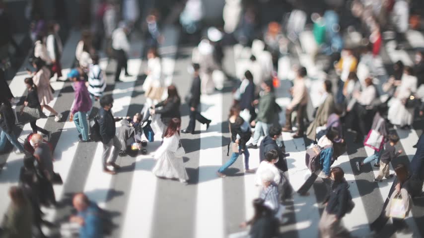 People Crossing a Busy Urban Crosswalk in Osaka Japan