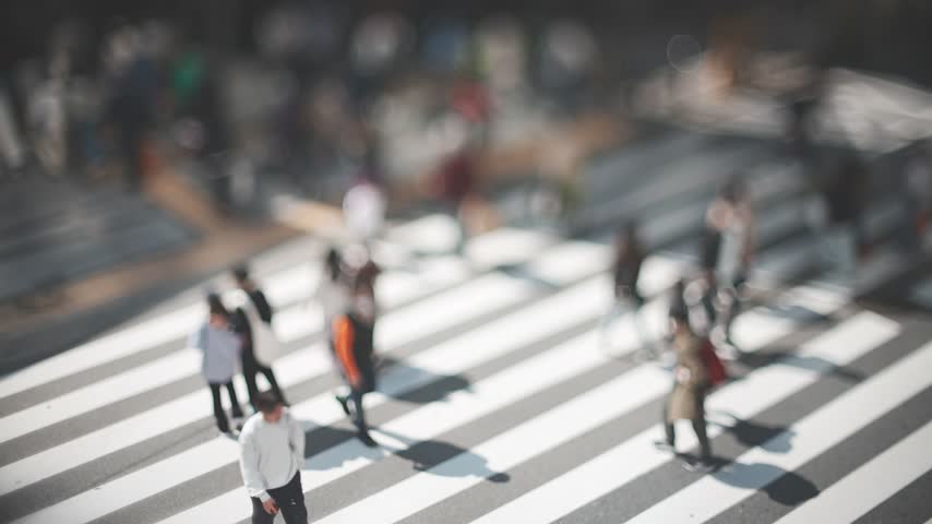 People Crossing a Busy Urban Crosswalk in Osaka Japan