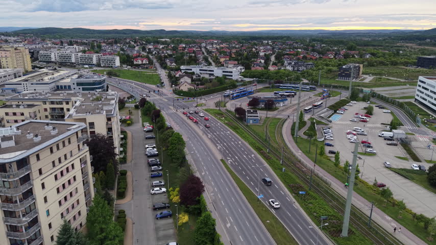Drone view of modern city roads, apartment blocks and traffic in a suburban district.