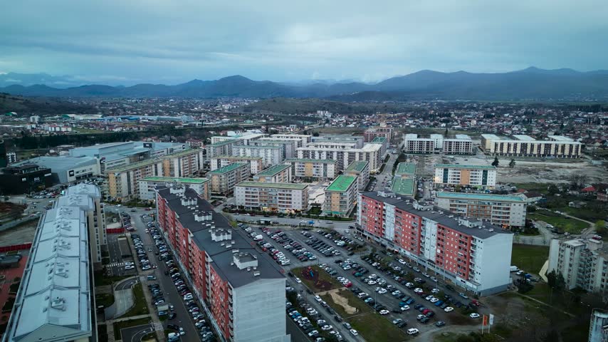 Aerial view of City Kvart residential district in Podgorica, Montenegro with modern apartment buildings and mountains in background