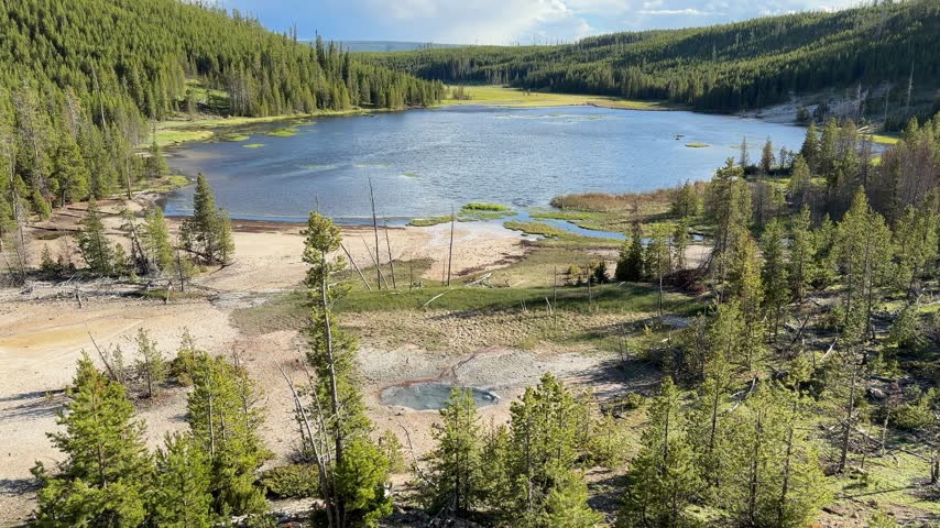 Yellowstone National Park - view of Nymph Lake and Roadside Spring, featuring dramatic landscape scenery