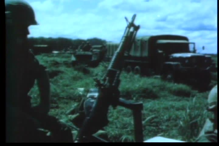 1960s - Members of an American armored cavalry unit move out during the Vietnam War