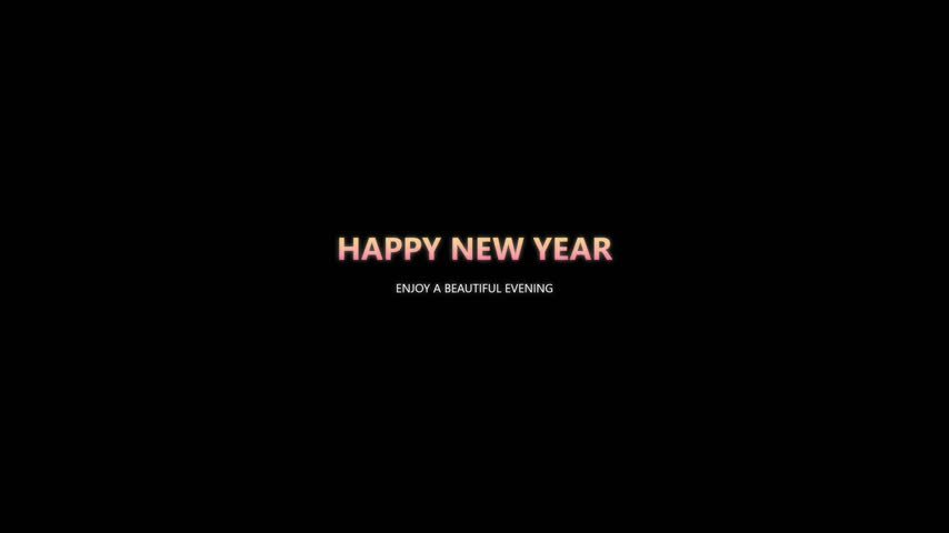 Colorful fireworks explosion and happy new year text on black sky