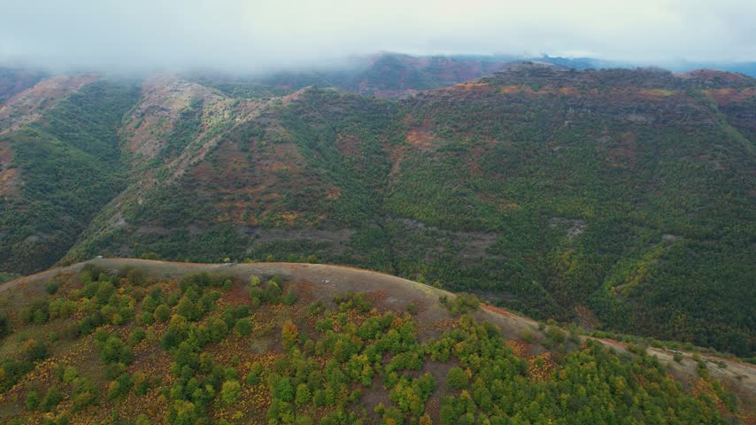 Dense clouds hanged over high mountains in Albania area of Mokra