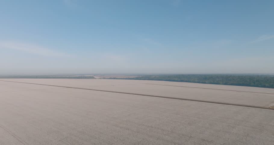 Cotton farm at harvest time. Aerial tilt down