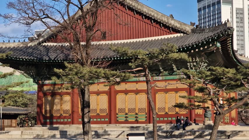 Old and Modern South Korea. Medieval Hall in Deoksugung Palace Complex and Downtown Buildings