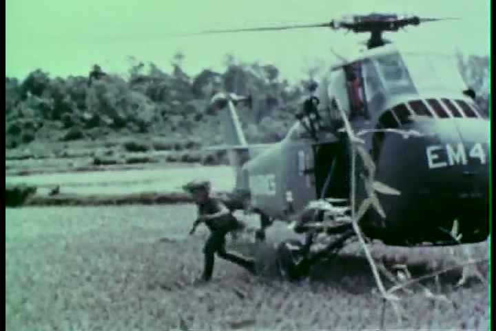 1960s - A group of Marines engage fight Vietcong forces during the 1960s