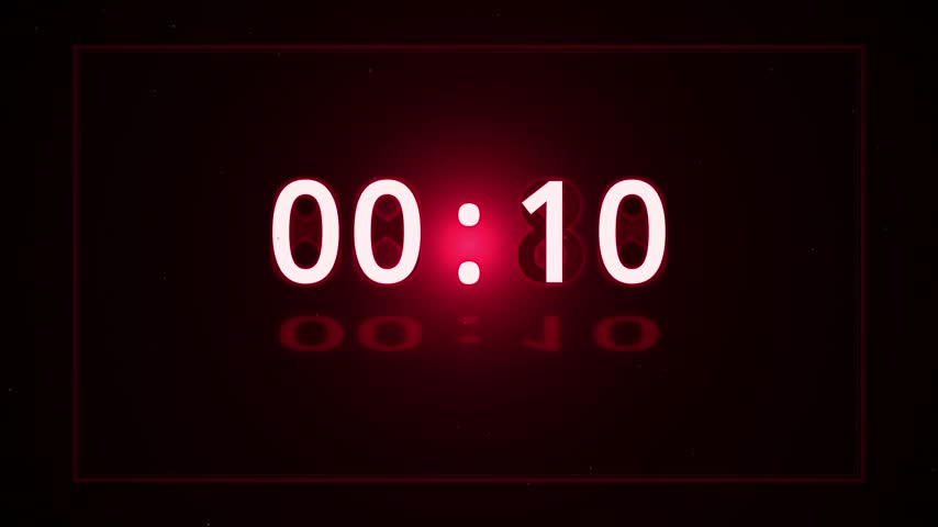 A large crimson red digital LED timer counts down from ten to zero on a dark background with a soft floor reflection and floating dust