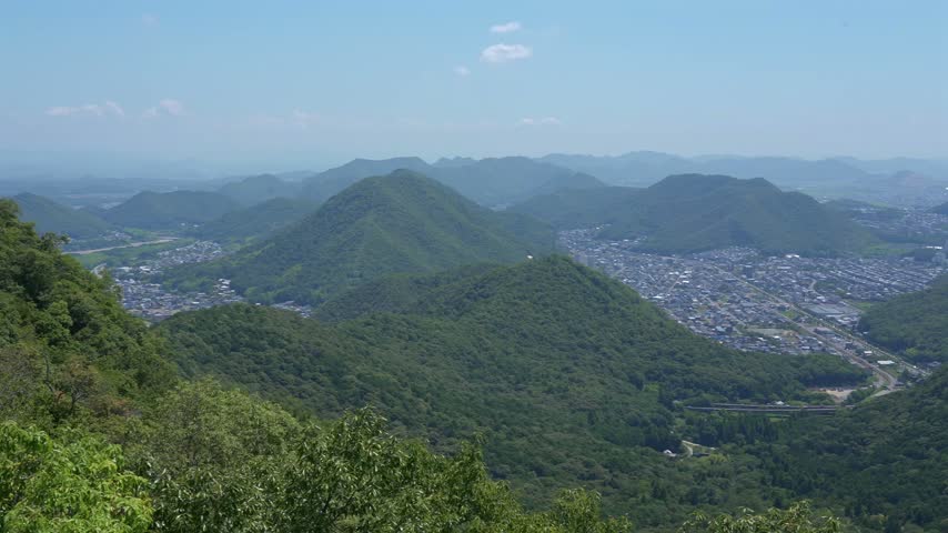 Panoramic mountain and city views of Nagoya metropolitan area from Mt. Kinka Gifu Japan