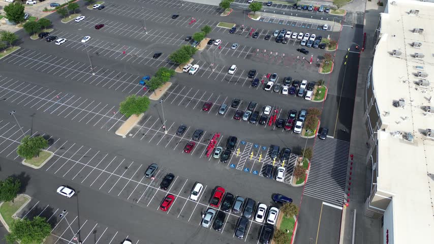 Winding secondary driveways weave past commercial parking structures inside Dallas County along South Richardson. Green buffer zones separate parking lanes outdoor, Richardson, Texas. USA.