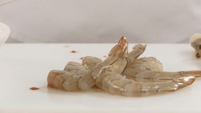 Cleaning prawns: removing the head and shell