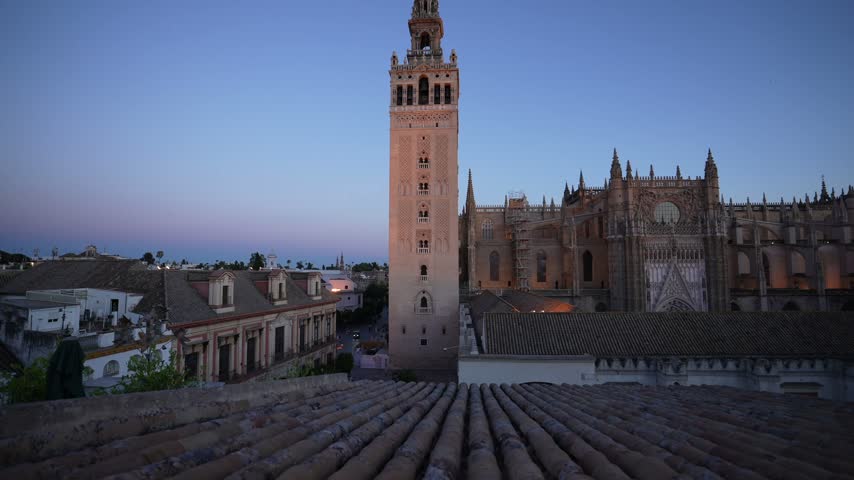 Elevated view of La Giralda and Cathedral of Seville at dusk, Seville, Andalusia, Spain, Europe