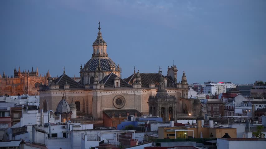 Elevated view of illuminated Seville Cathedral and La Giralda at dusk, Seville, Andalusia, Spain, Europe