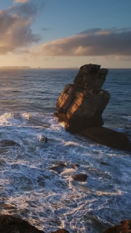 Ocean cliff rock by the sea at sunset in Cabo Carvoeiro, Peniche, Portugal