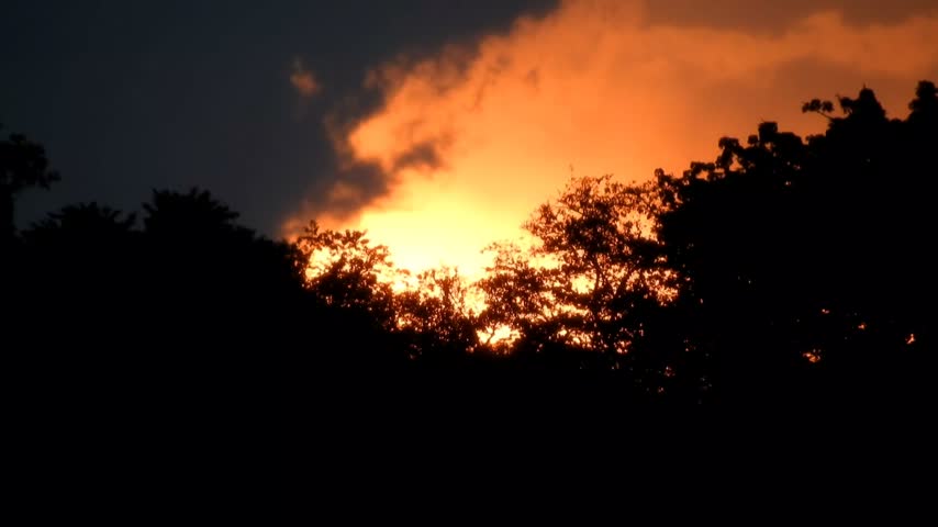 Dramatic Orange Sunset Sky with Glowing Clouds