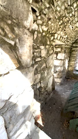 Vertical View Inside a Historic Stone Mausoleum in Seferihisar, Turkey