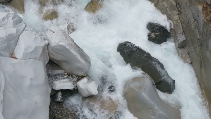Powerful River Rapids Flow Over Sculpted Rocks at Othello Tunnels, Near Hope, British Columbia, Canada