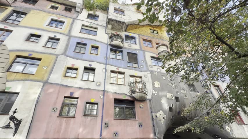 Facade of the Hundertwasserhaus seen from the inner courtyard, a tourist site in Vienna, Austria.