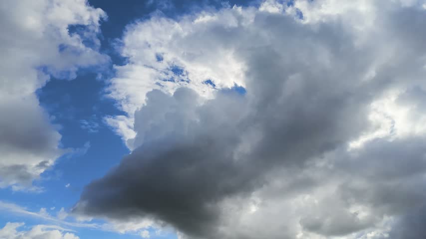 Dramatic clouds timelapse changing weather from bright blue sky to dark storm