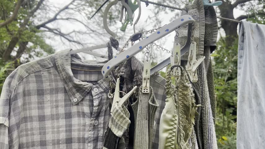 Laundry hangs on a clothing line at a camping site. 