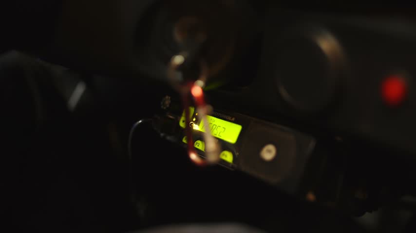 Close up of car radio display while car is driving
